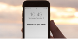 "Why am I in your Hand?"  A screensaver photo showing the time, and this message.
